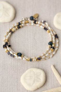 This transitional piece offers versatility in wear. It is a simple collage of fresh water pearl, kyanite, and iolite that can be worn as a necklace or wrapped around your wrist and worn as a bracelet. However, the necklace can also be clasped to another piece in this collection (SEA044C) to have a long collage necklace that can be worn wrapped at the neck. Sterling silver (lead and nickel free) Fresh Water Pearl, Kyanite, Iolite 21.75", non-adjustable with sterling silver lobster claw clasp We h Collage Necklace, Sundance Jewelry, Blessing Beads, Simple Collage, Beautiful Beaded Bracelet, Pearl Necklace Designs, Freshwater Pearl Jewelry, Designer Handmade Jewellery, Kids Bracelets