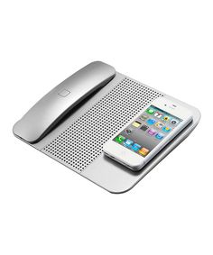 an iphone is sitting on top of a speaker