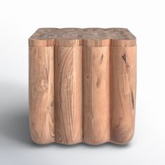 three wooden stools sitting next to each other on a white surface and one is made out of wood