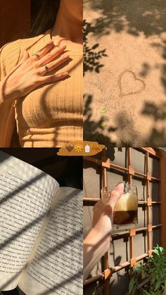 a woman holding an open book next to a window with a heart drawn on it