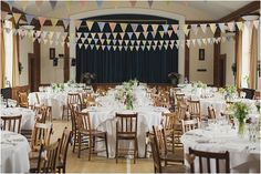 a banquet hall set up with tables and chairs