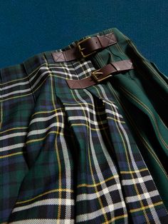 Crafted in a beautiful Italian wool, this pleated wool skirt brings the timeless tailoring of traditional tartan styles, with a leather strap closure at the side and mixed patterns for added edge that begs for a layered approach.  RELAXED FIT: Cut wi Tartan Skirts, Tartan Fashion, Pleats Skirt, Mixed Patterns, Tartan Skirt, Tartan Kilt, Flatlay Styling, Wool Skirt, Plaid Skirt