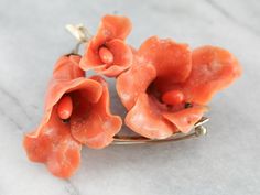 This is a stunning and large intricately and beautifully carved brooch or pendant! With wonderfully polished, textured gold branches and leaves, and beautiful undyed natural coral! The coral is amazingly carved in the shapes of lily blossoms, giving it an amazing three-dimensional quality! This really is a superb and high-quality piece, hand-made of beautiful materials and stunning attention to detail! It's in fabulous condition as well! Metal: 14K Yellow Gold Gem: Carved Coral Gem Measurements: Peach Dresses, Fine Jewlery, Gold Branches, Angel Skin, Coral Pendant, Gold Pin, Antique Brooches, Coral Earrings, Natural Coral