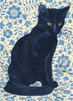 a black cat sitting on top of a blue and white flowered background with yellow eyes