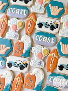 decorated cookies are arranged in the shape of cars, trucks and people with names on them