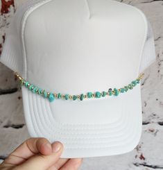 Introducing our latest accessory innovation: the Truckin' Tunes Hat Chain! Crafted for those who embrace the open road and the rhythm of the journey, our hat chain adds a dash of musical flair to your favorite trucker cap. Picture this: a sleek, silver chain adorned with miniature guitar picks, each one a testament to your love for music and adventure. Whether you're cruising down the highway or jamming at a roadside pitstop, let your style sing with every stride. The Truckin' Tunes Hat Chain isn't just about looks; it's practical too. Need a pick for an impromptu jam session? No problem! Simply unhook one from your hat chain and let the music flow. Made for durability and style, our hat chain is the perfect addition to any trucker hat aficionado's wardrobe. So, buckle up, hit the road, an Trucker Hat Chains, Concert Hat, Hat Chain, Music Flow, Miniature Guitars, Hat Jewelry, Custom Trucker Hats, Hat Bands, Jam Session