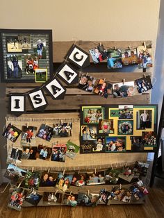 an old pallet is decorated with photos and letters that spell out the word sale