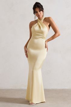 Exude confidence at your next event in this show-stopping maxi. Unbeatable. Arriving in a soft lemon hue of a premium satin. this backless piece features a cross over halter-neck thats finished with wide self-tie straps for the perfect custom fit. For an elegant bridesmaid attire. try styling yours with our Just A Fling court shoes. Features - Premium satin- Cross over halter neckline- Open back- Invisible zip closure - Fishtail skirt- Maxi length Sizing & Fit Model is 5'8 and wears UK size 8 / Bridesmaid Attire, Club L London, Halter Neck Maxi Dress, Black Dress Prom, Exude Confidence, Fishtail Skirt, Black Tie Gala, Party Dress Long Sleeve, Skirt Maxi