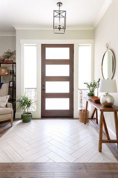 a living room filled with furniture and a wooden door