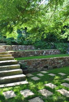 stone steps lead up to the back yard