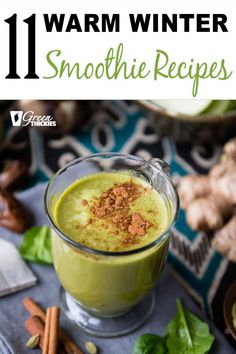 green smoothie in a glass with cinnamon sprinkled on top and the words 11 warm winter smoothie recipes