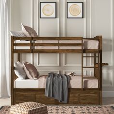 the bunk bed is made up with two sets of mattresses and pillows on it