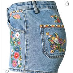 Cute Denim Shorts With Designs On The Front And Back - Size: Small - Denim Cotton No Stretch - Embroidery - Never Worn Trendy Jean Shorts For Spring Festival, Trendy Floral Embroidered Denim Blue Bottoms, Trendy Embroidered Mid-rise Bottoms, Trendy Denim Blue Bottoms With Floral Embroidery, Casual Embroidered Jeans For Summer, Mid-rise Summer Festival Jeans, Summer Festival Mid-rise Jeans, Embroidered Denim Bottoms In Medium Wash, Embroidered Medium Wash Denim Bottoms