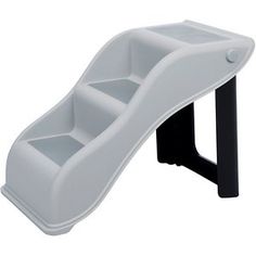 a white plastic slide that is on top of a black stand