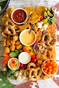 a platter filled with snacks and dips