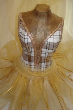 a mannequin wearing a dress with gold sequins