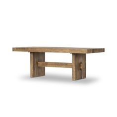 a wooden table sitting on top of a white floor