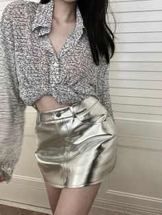 Shine brighter than a star in our Corine Metallic Mini Skirt! Whether you rock the silver or pink style, you'll be rocking like a rockstar! Make sure to twirl and show off the pleated accents of your skirt - it's guaranteed to turn heads. Sparkle and shine on! Gender: WOMENItem Type: SkirtsSilhouette: A-LINEMaterial: Faux LeatherElasticity: Non StretchDresses Length: Above Knee-LengthDecoration: Zipper SIZE CHART Model: 86/62/86 (34"/25"/34") wearing XS, Height 168cm/46kg Size Waist Hip Length X Metallic Mini Skirt, Like A Rockstar, A Line Shorts, Y2k Clothes, Pink Style, Straight Trousers, Long Sleeve Knit Tops, You Rock, Shine On