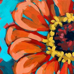 an orange and red flower is shown on a blue background, with yellow petals in the center