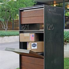 an open mailbox with boxes in it