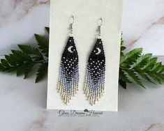 "Miyuki Delica Glass Seed Beads: Colors:  Black,  Eggshell, Silver Gray, Silver These earrings are timeless, light as a feather and comfortable to wear hanging approximately 4\" from the top of the ear wire and measure 1\" at the widest point. They are carefully hand woven using strong beading thread. Wear these earrings to fit your mood whether it be daytime casual or evening partying, pair them with a great outfit and enjoy the eye-catching attention. A beautiful blend of colorful beads with a Star Beaded Earrings, Lampwork Glass Pendants, Long Tassel Earrings, Pumpkin Earrings, Metallic Pink, Comfort Wear, Beaded Fringe, Fringe Earrings, Handmade Ornaments