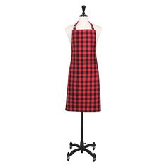 a red and black checkered apron on a mannequin