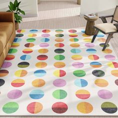 an area rug with multicolored circles on it in a living room next to a couch