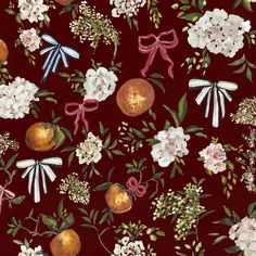 a red background with white flowers and oranges on the side, tied in pink ribbon