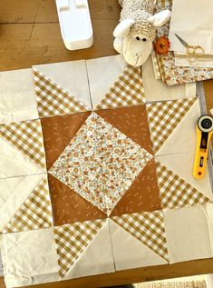 the table is set up with quilts and scissors