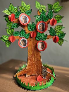 an apple tree with pictures on the leaves