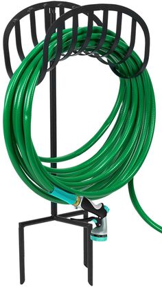 a green hose is attached to a black stand