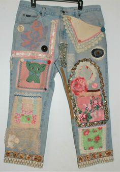 a pair of jeans with patches and flowers on them