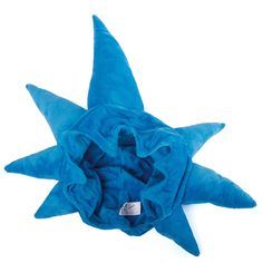 a blue star shaped pillow on a white background