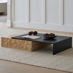 a coffee table with two bowls on it