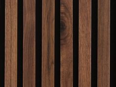 wood slats are lined up against a black background in this close - up photo