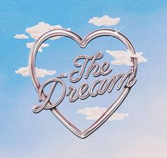 a heart shaped sign with the words the dream on it in front of a blue sky