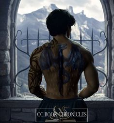 a man with tattoos on his back standing in front of an arch looking out at the mountains