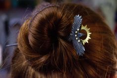 The Raven hairpin is a unique hair accessory, hand--forged from blackened steel.  It is made in the shape of a raven, which makes it not only functional, but also decorative, and the brass sun gives it a particularly refined look with its contrast.  Due to its strength and reliability, the forged hairpin "Raven" will serve you for many years. She will not lose her appearance and will delight you with her beauty and elegance. This accessory will be a great addition to any outfit and will emphasize your personality. Do not miss the opportunity to purchase this unique accessory for your hair! Size: 160 х 50 х 5 mm Weight: 22 g If you have any questions, please contact us and we will definitely give a respond! Grand Jewellery, Raven Feather, Unique Hair Clip, Ritual Magic, Unique Hair Accessories, Feather Hair Clips, Goth Wedding, Blackened Steel, Unique Hair