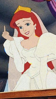 the little mermaid is smiling and waving at someone in front of her, while she's wearing a tiara