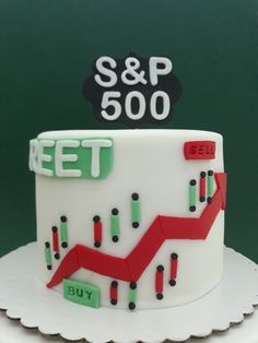 a white cake with red and green arrows on it that says s & p 500