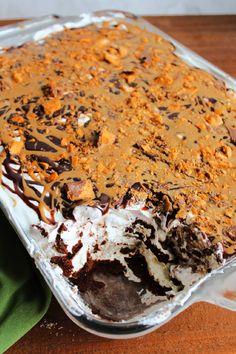 a chocolate dessert in a pan on top of a wooden table