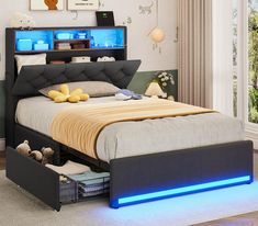 a bed with blue lights underneath it in a room