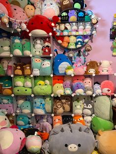 a wall full of stuffed animals and toys