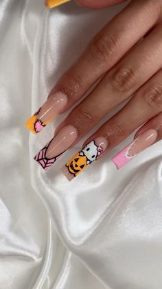 Get ready to embrace the fall season with Halloween and autumn- inspired nail designs! From cozy fall tones to cutesy hello kitty halloween inspired nails🎃 these nails capture the magic of fall Nail Design Ideas Halloween, Pink Hello Kitty Halloween Nails, Halloween Nail Designs Hello Kitty, Orange Hello Kitty Nails, Hello Kitty Ghostface Nails, Halloween Nail Sets Short, Hello Kitty Frankenstein Nails, Halloween Hello Kitty Nails Acrylic, Holoween Nail Design