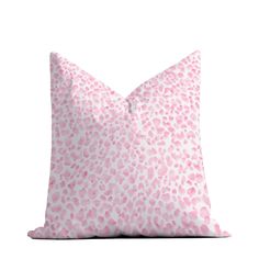 a pink and white leopard print pillow on a white background