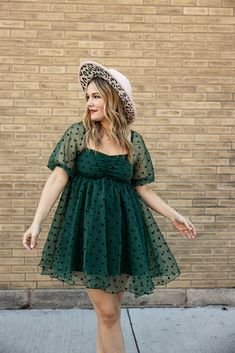 the everly babydoll dress will bring out your inner boho-bougie side. featuring a mini dress style, puffy sleeves, and polka dot pattern in fashionable hunter green, this dress is dreamy, stylish, and just a little bit sassy. transform your wardrobe with one effortless flourish! Plus Size Babydoll Dress, Plus Size Holiday Party Outfit, Baby Doll Dress For Women, Fantasy Sewing, Sabrina Outfits, Dresses For Short Women, Dresses Plus Size Casual, Dress With Combat Boots, Babydoll Dress Outfit