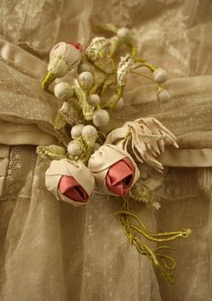 a bouquet of flowers sitting on top of a dress