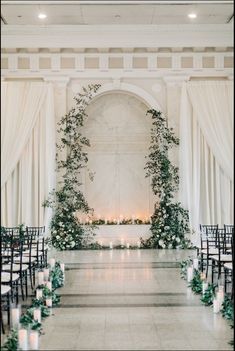 an indoor ceremony with candles and greenery