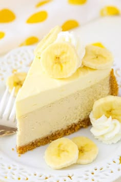 a piece of cheesecake on a plate with bananas