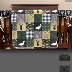 a baby crib bedding set with ducks and geese on it